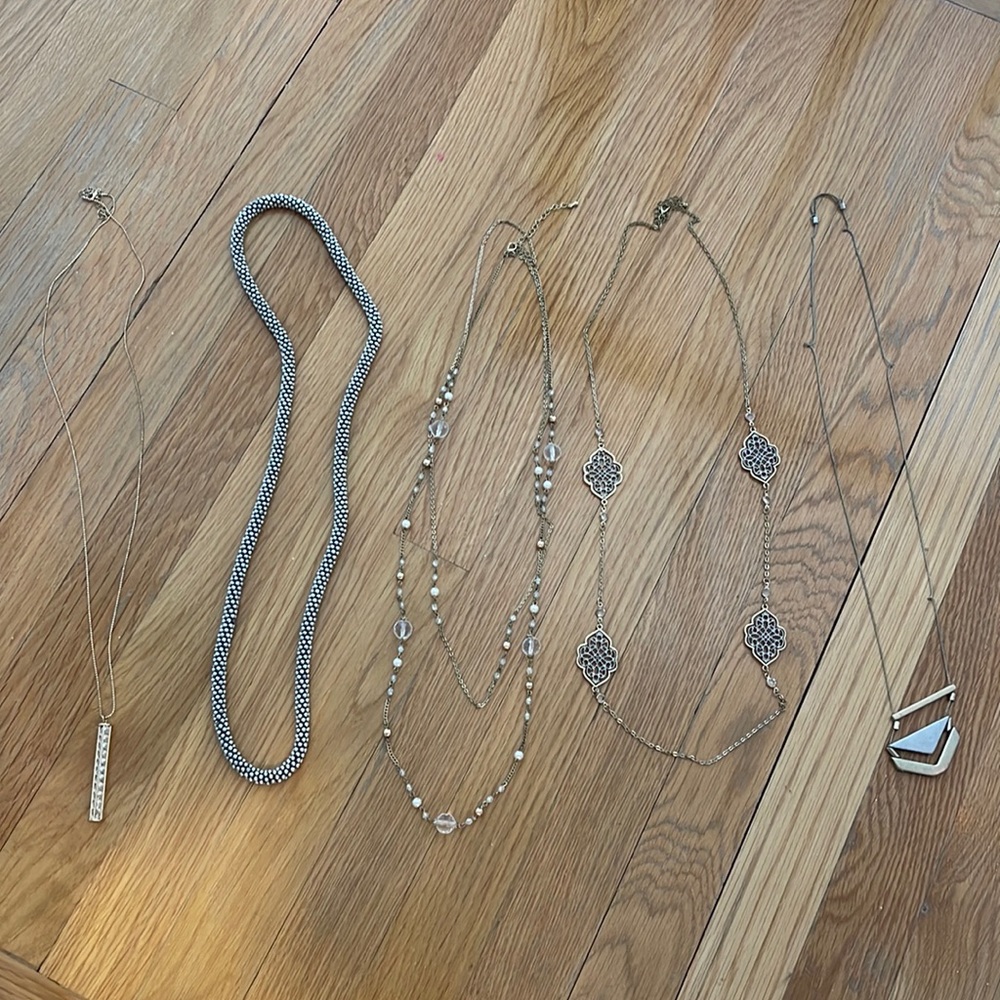 Bundle of long statement necklaces